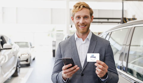 Car salesman holding digital business card with nfc mTap